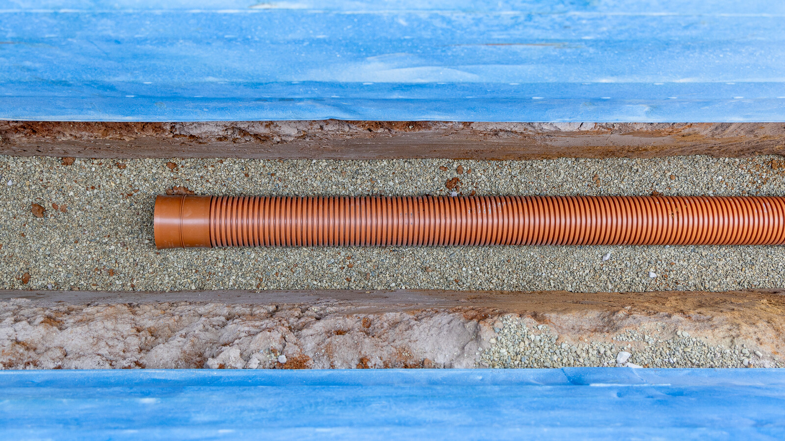 top down shot of MetroSewer pipe installation in a trench box