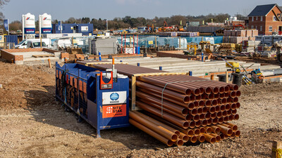 A full pack of drainage pipes stacked in a SiteStak storage system at M&J Evans construction site