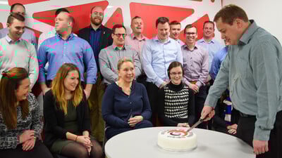 Drainfast opens Vision House Petersfield Peter cutting cake in celebration